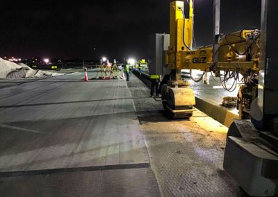 Boh Bros leveling out asphalt at Louis Armstrong Airport
