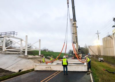 Boh Bros. crane lifting steel truss to build dock.